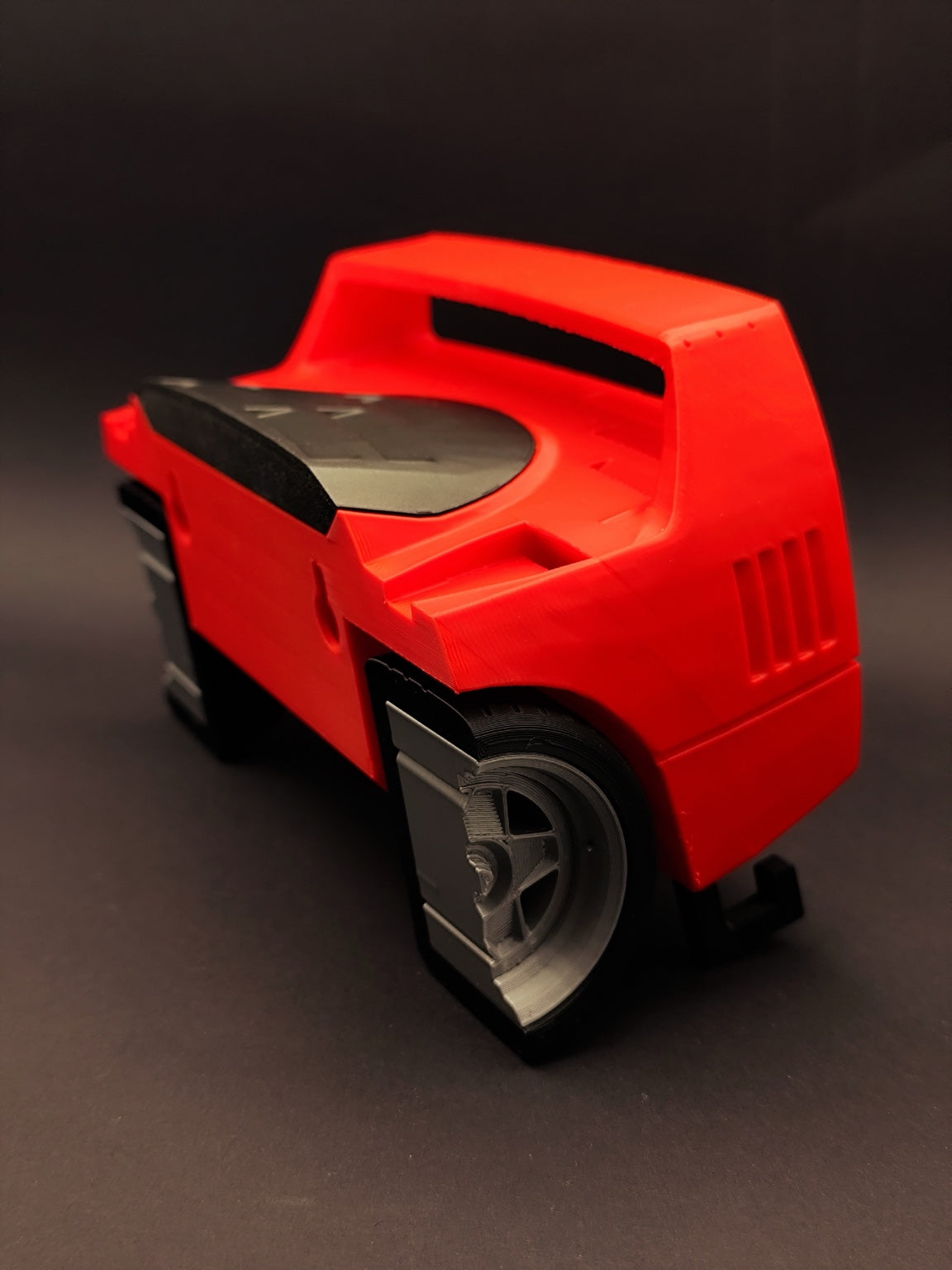 Red F40-inspired 3D printed automotive key holder showing wheel and rear body details
