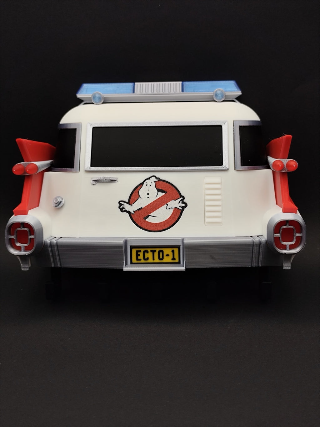 Front view of 3D printed Ghostbusters Ecto-1 wall key holder with five black hooks