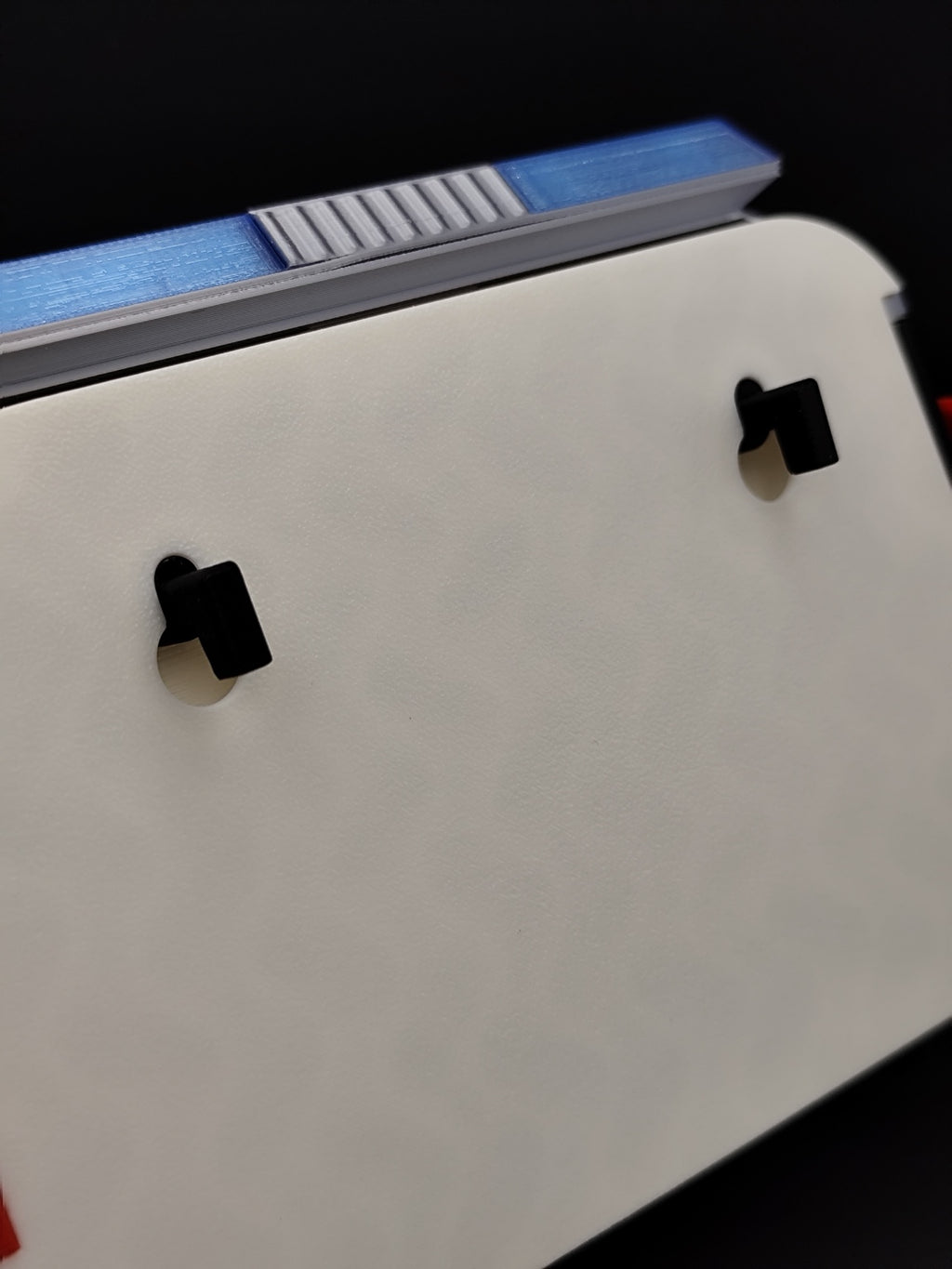 Close-up of rear keyhole mounting slots on Ghostbusters Ecto-1 3D printed key holder