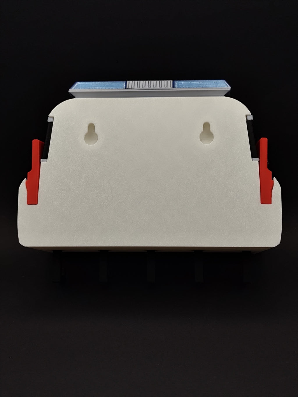 Back of 3D printed Ghostbusters Ecto-1 key holder showing two keyhole wall mounting slots