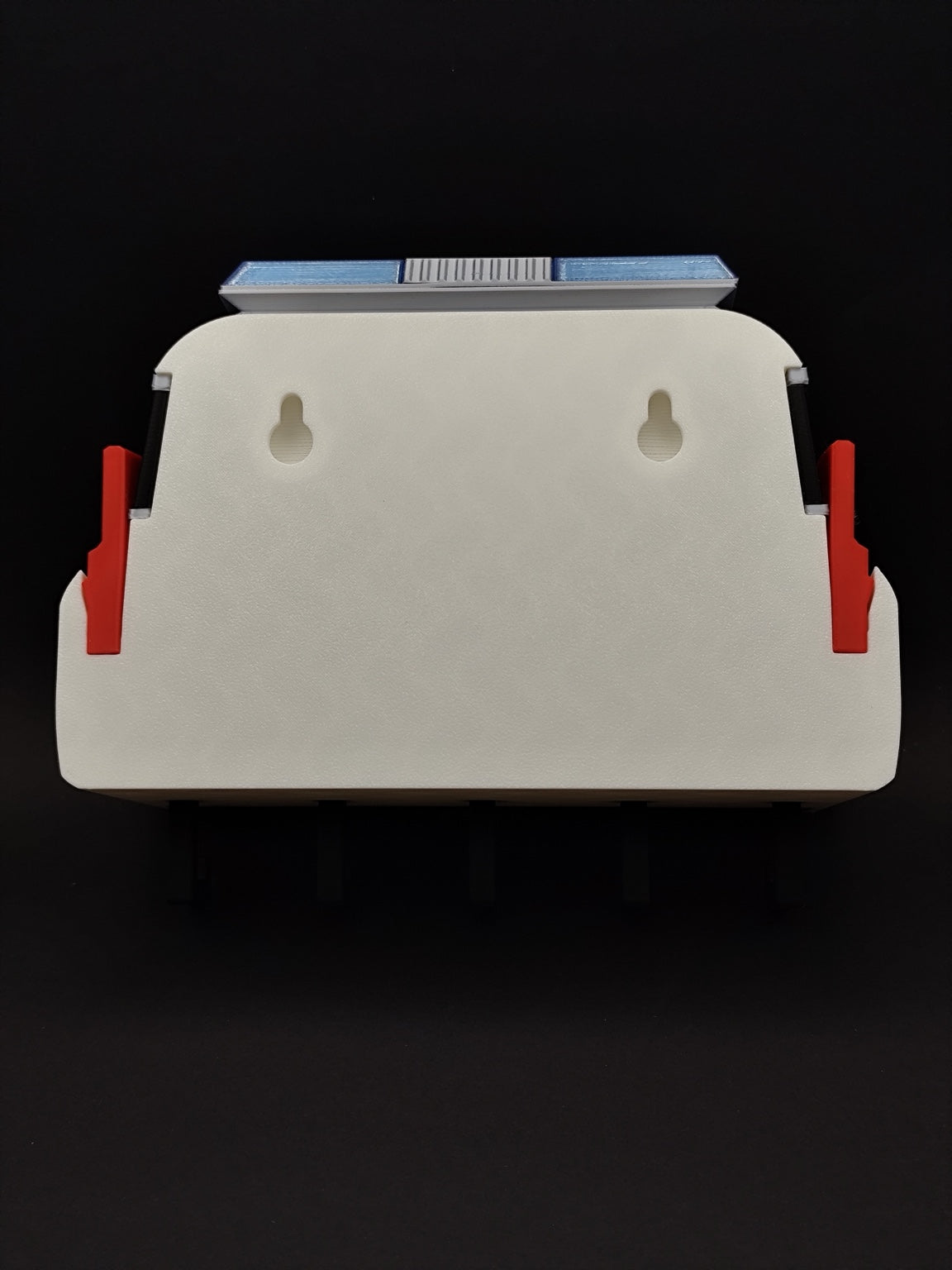 Back of 3D printed Ghostbusters Ecto-1 key holder showing two keyhole wall mounting slots