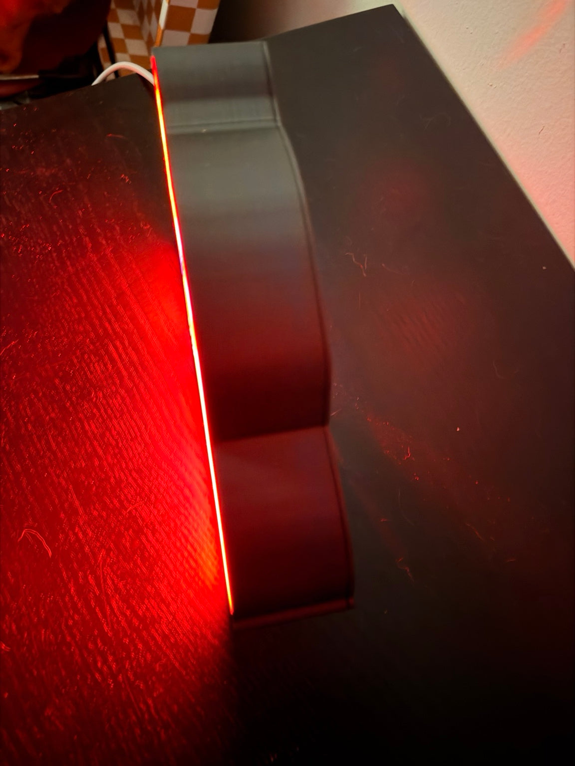 3D printed Lightning McQueen LED lightbox side view showing red glow