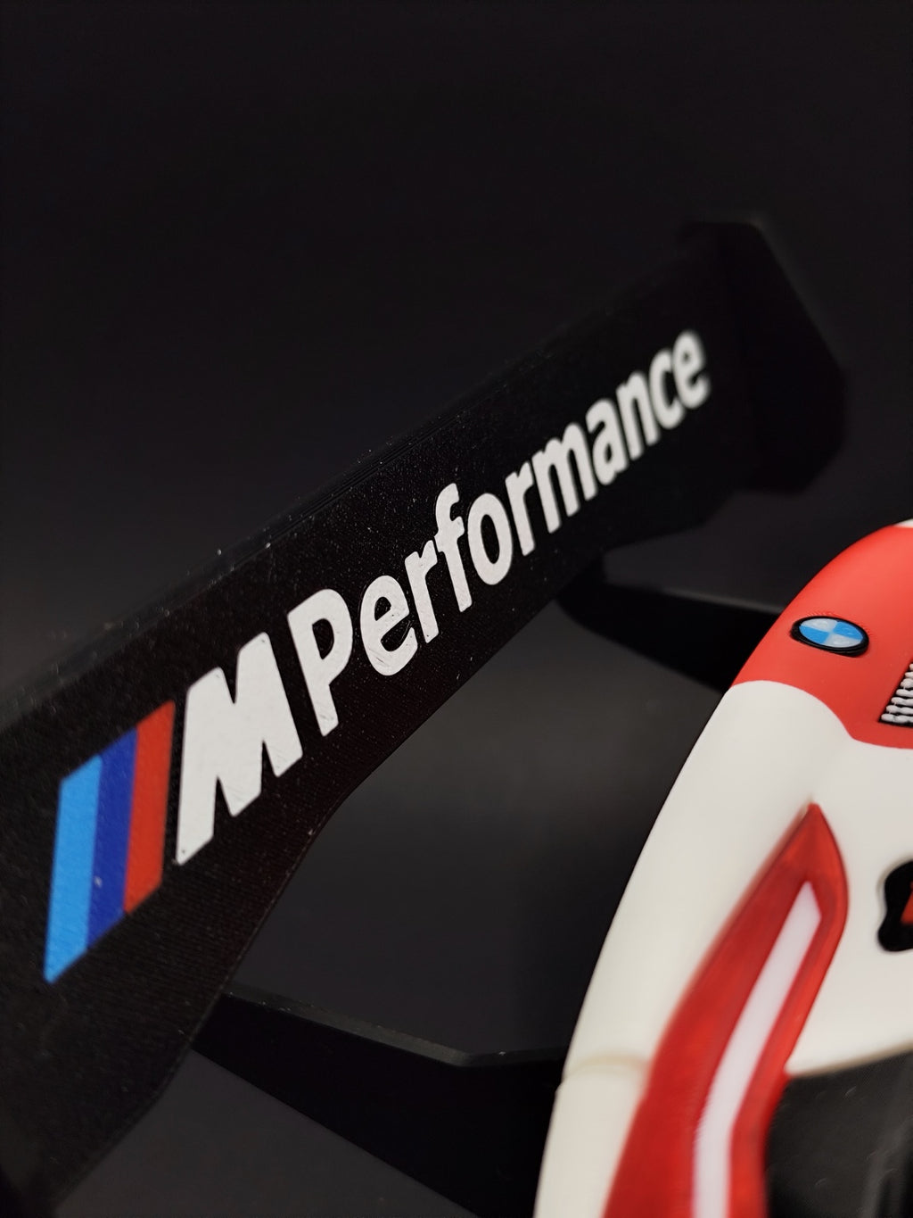 Close-up of the M Performance lettering on the M4 GT3 rear wing