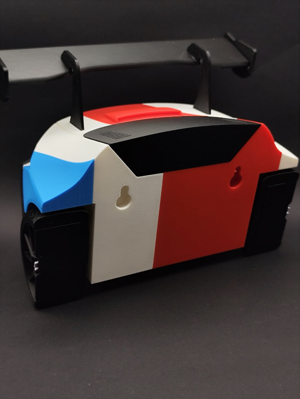 Back of the M4 GT3 key holder showing two keyhole mounting slots