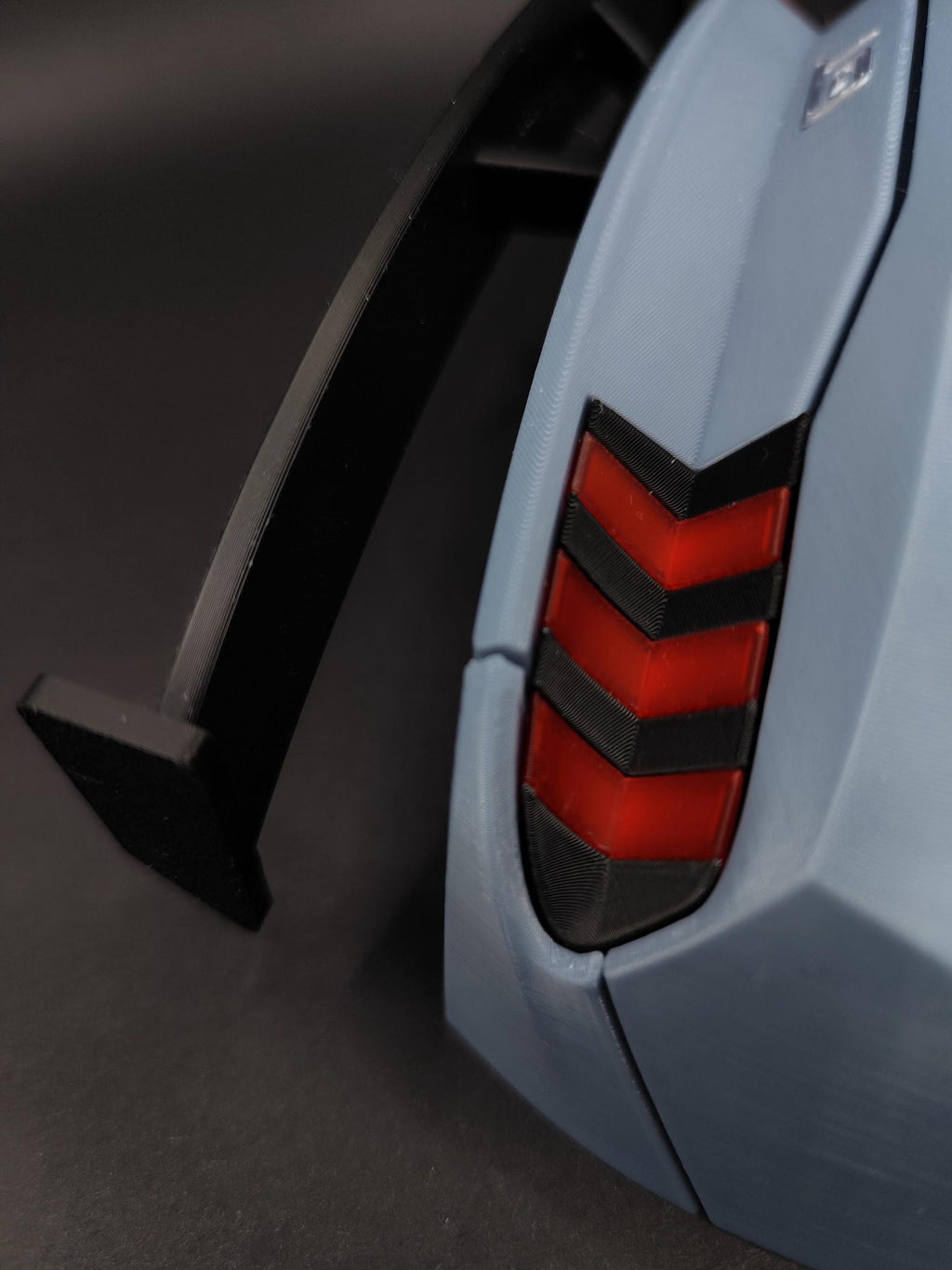 Detailed 3D printed car key hanger with quad exhaust and rear spoiler styling