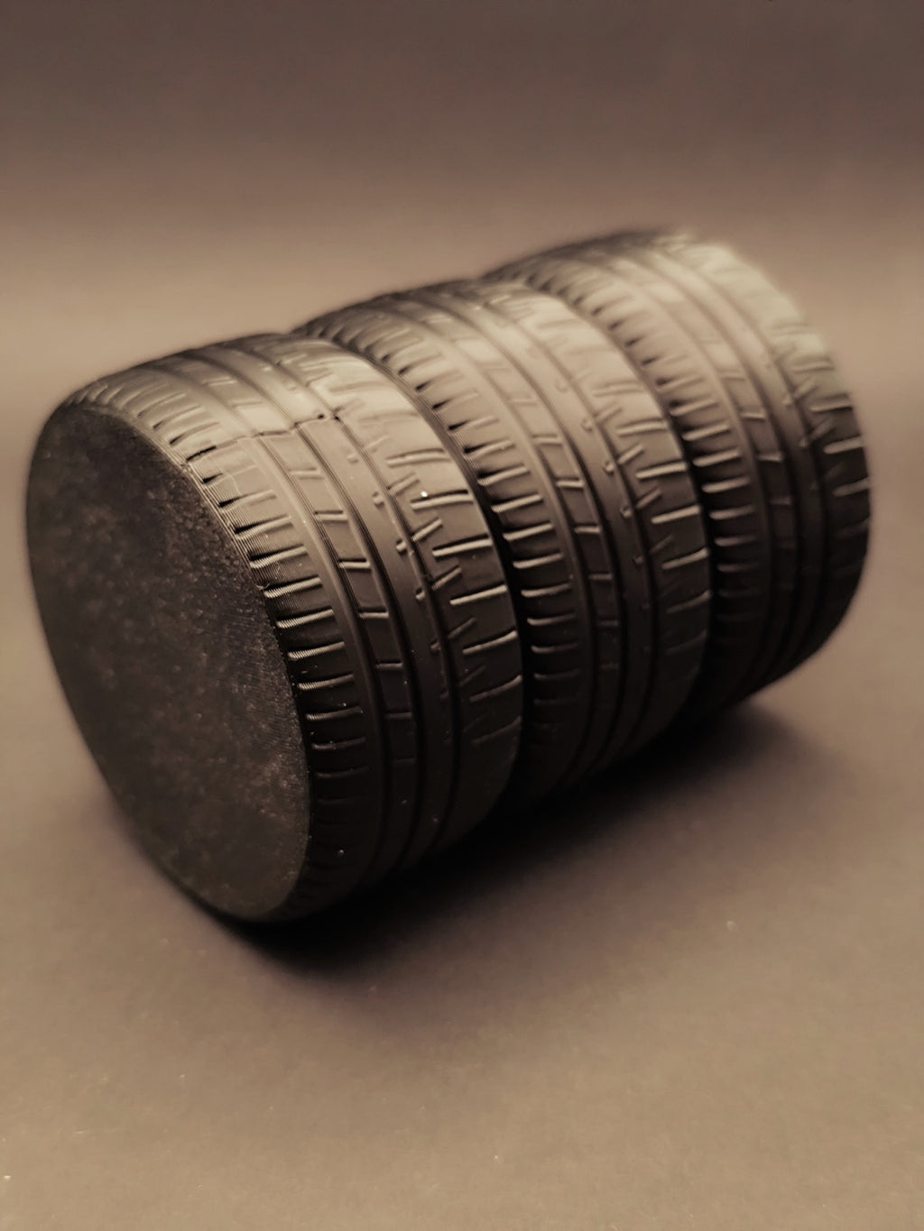 Bottom view of the stacked tire pen holder showing flat base