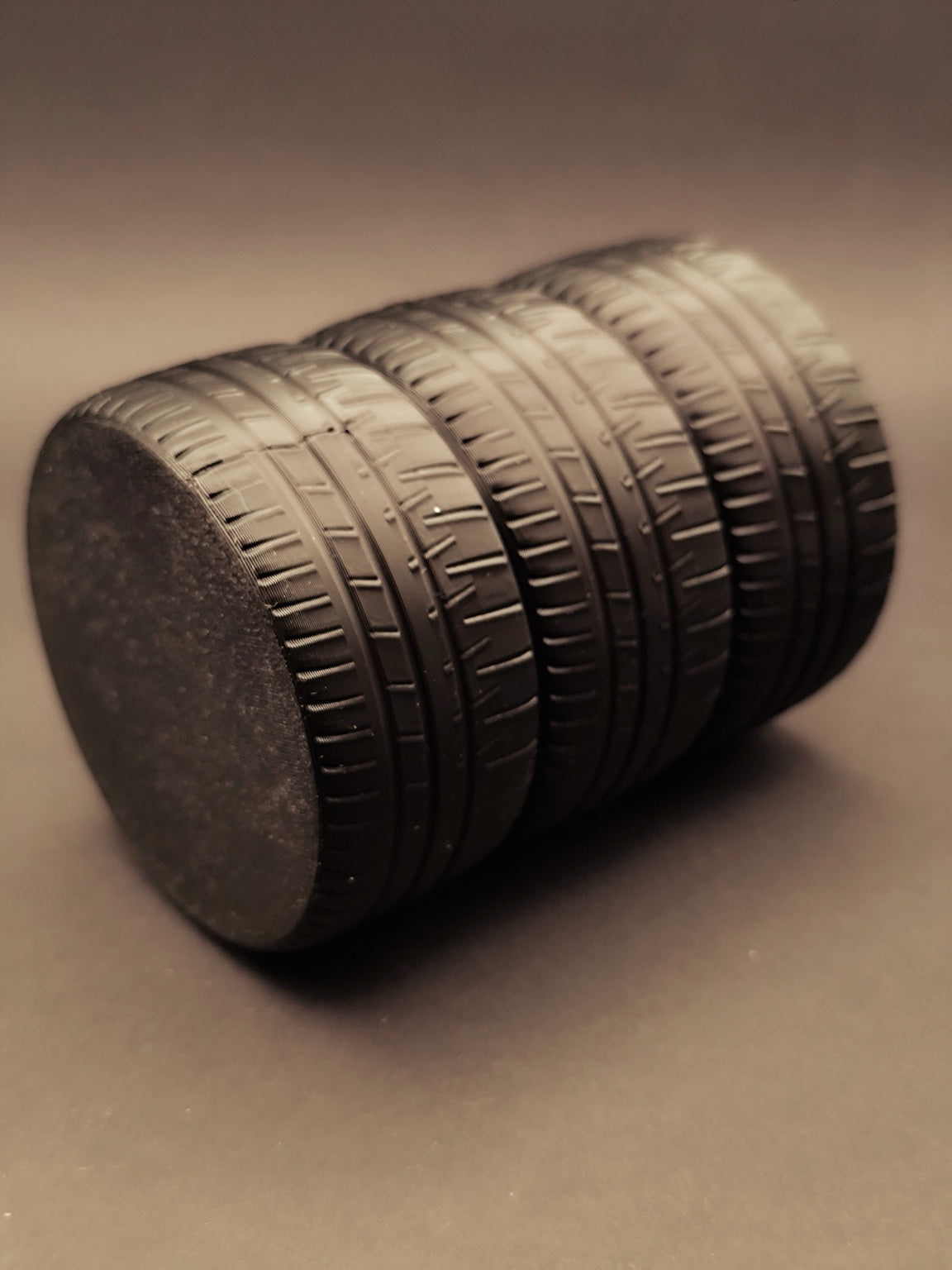Bottom view of the stacked tire pen holder showing flat base