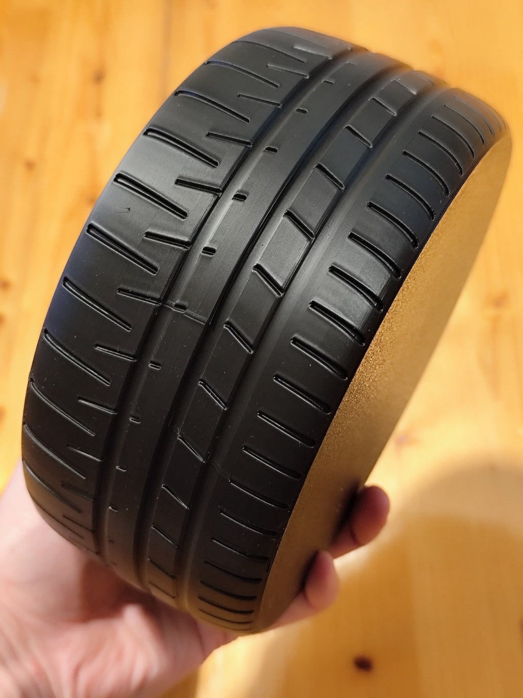 Close-up of realistic tread on the black 3D printed tire catchall bowl